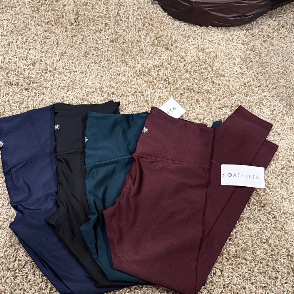 Athleta women’s Elation sheen leggings. Size medium. Navy, Black, Teal, Maroon